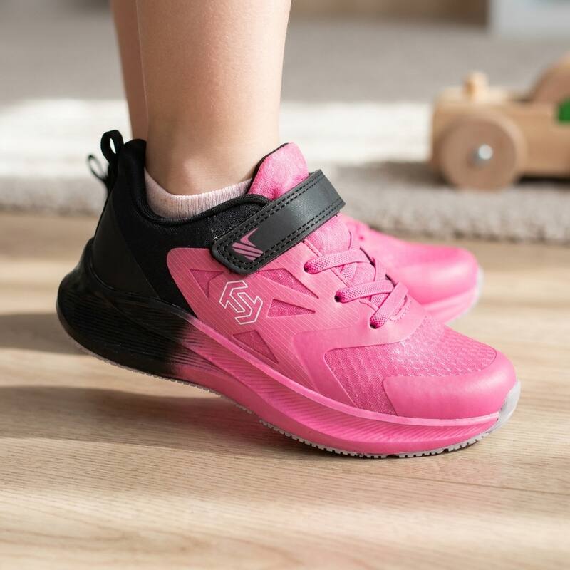Pink/Black Lastwell sneaker on a child's foot